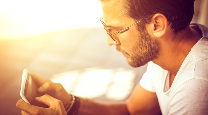 SunSync Light-Reactive Lenses provide blue light defense outdoors from sun and digital devices